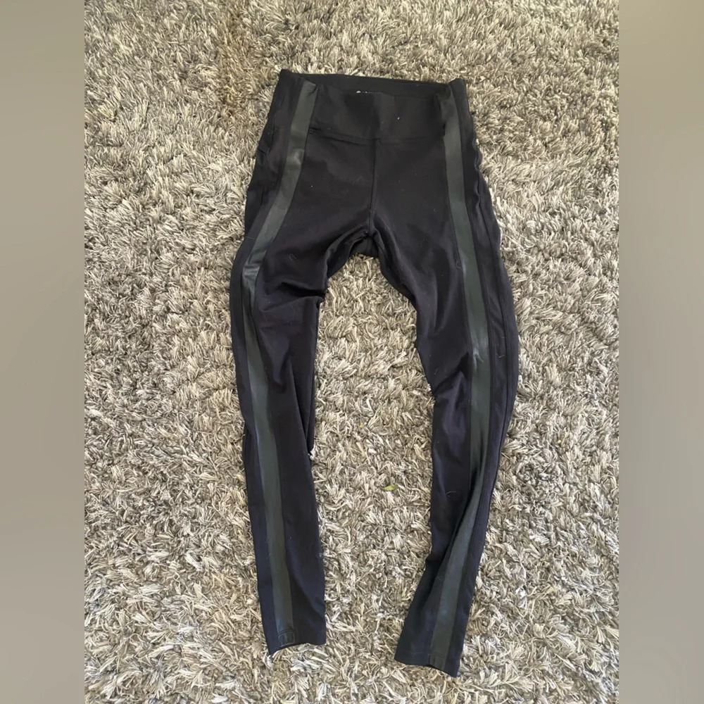 Black leggings with back zip pockets  and faux leather
